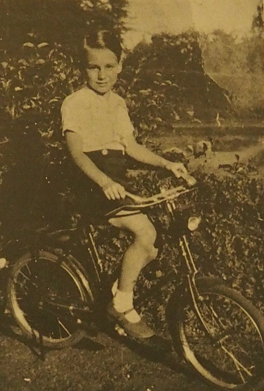 Prince Karim Aga Khan on his bicycle.