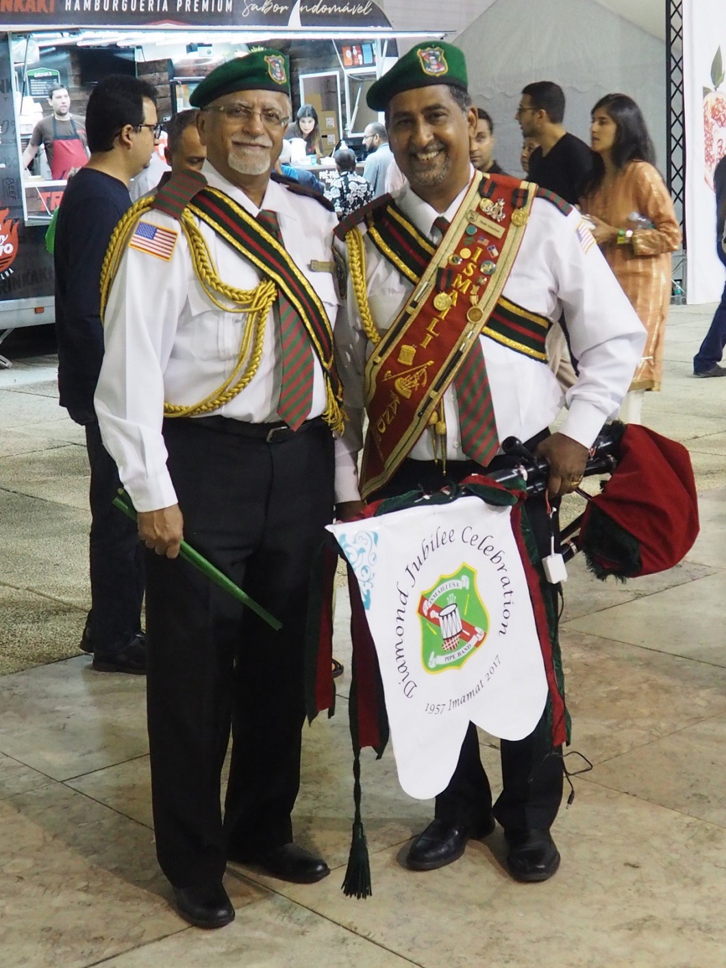 Two senior and highly decorated members of the Ismaili pipe band