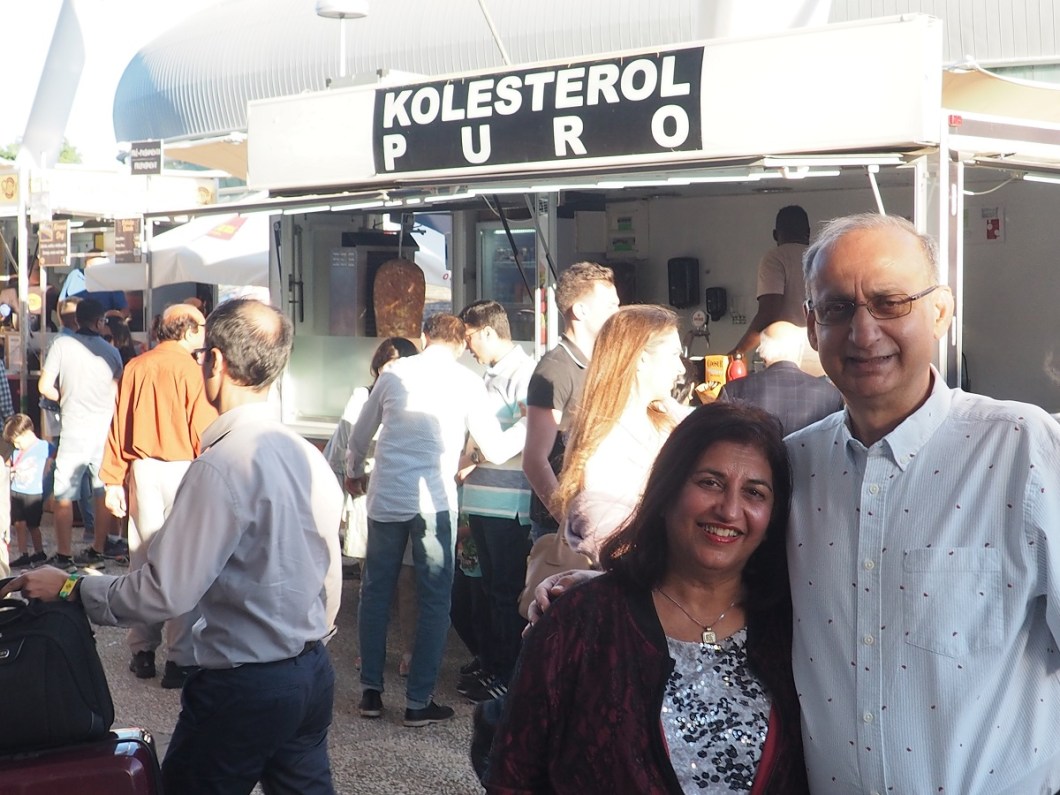 Salim and Nevin Kanji near food stand Kolesterol Puro