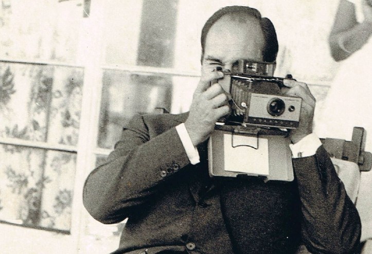 Aga Khan in Mtawra Tanzania, 1966. Tries out polaroid.