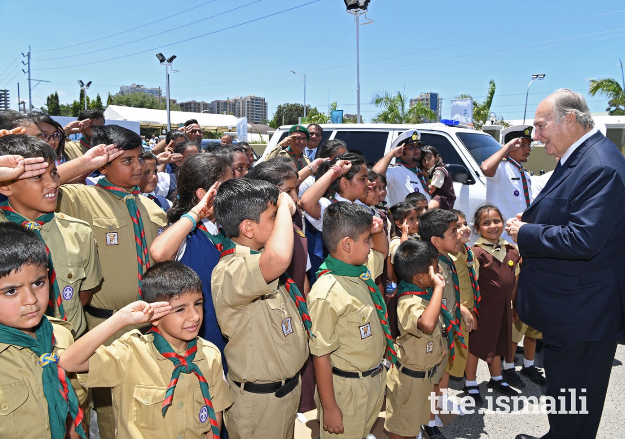 Mawlana Hazar Imam is greeted by Aga Khan Scouts and Guides, as he leaves Diamond Jubilee Hall after the Darbar. Photo: The Ismaili/Zahur Ramji.