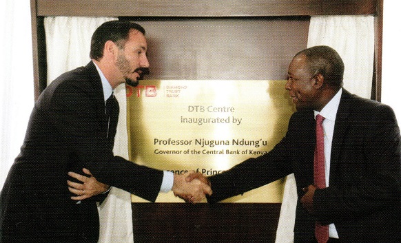 Prince Rahim Aga Khan and Professor Njuguna Ndung'u, Governor of Central Bank of Kenya shake hands following the unveiling of the plaque to inaugurate the DTB Centre in Nairobi on January 16, 2014. P