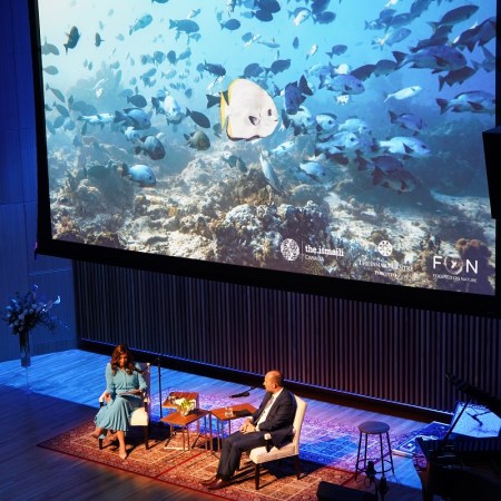 A photograph taken by Prince Hussain Aga Khan during one of his dives into the ocean is projected on the screen as Farah Nasser engages the Prince in a conversation during his presentation of The Living Sea - Fragile Beauty at the Aga Khan Museum