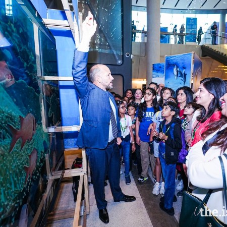 Students from the UAE Jamat enjoy a visit to Prince Hussain's photo exhibition at COP28.