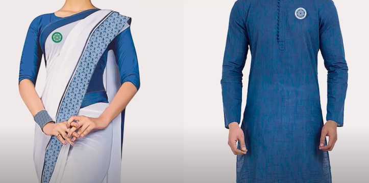 A woman wearing a traditional blue and white sari with a badge on the shoulder, standing next to a man in a blue kurta with a badge on the chest, both displaying the new Ismaili volunteers attire.