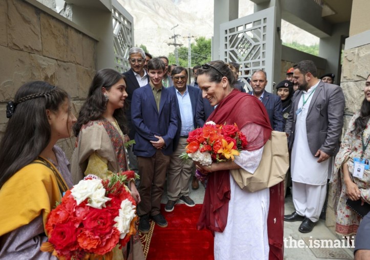 Princess Zahra Aga Khan is greeted with a bouquet of flowers upon arriving at the new Aga Khan Hostel in Sherqilla