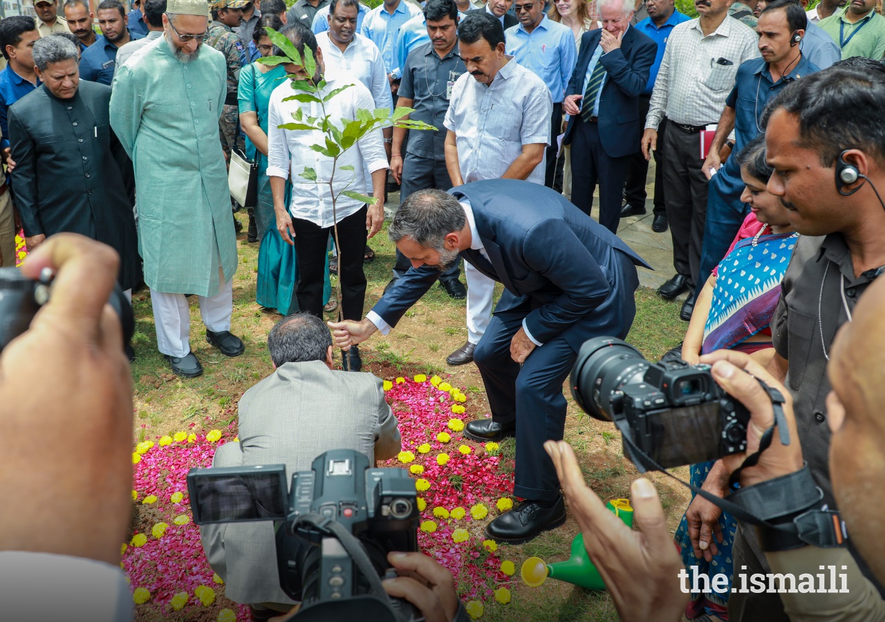 Prince Rahim Aga Khan helps to plant a tree during the inauguration ceremony of the Qutb Shahi Heritage Park in Hyderabad