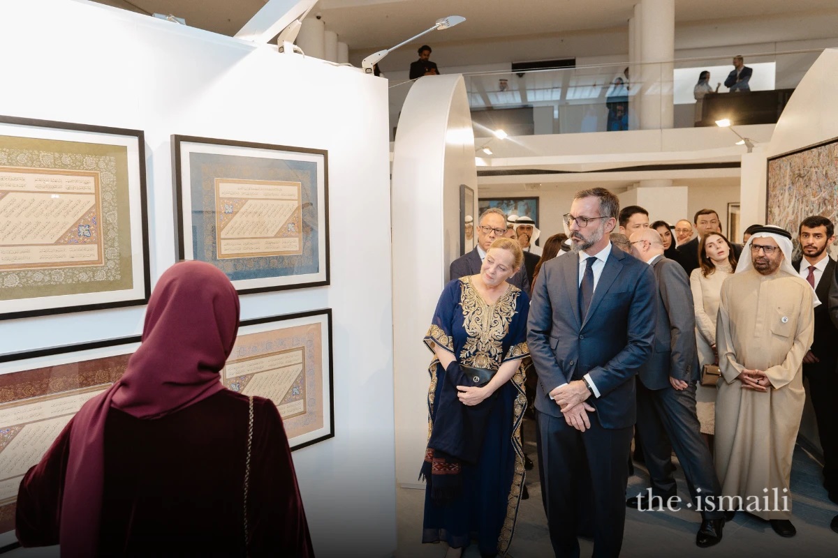 Fatma Al Mahmoud, a curator of the Al Burda Exhibition, showcases artwork to guests including Dr Ulrike Al-Khamis, Director and CEO of the Aga Khan Museum, and Prince Rahim Aga Khan. Barakah a dedication to the Aga Khan and Ismaili Imamat