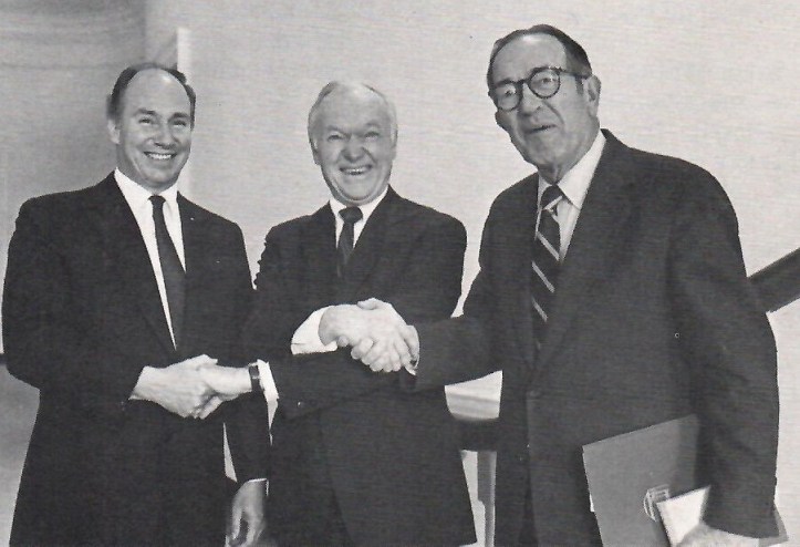 Virginia University President, Frank L. Hereford Jr. (centre) simultaneously congratulates Mawlana Shah Karim (left) and former US Attorney-General Griffin Bell who were respectively presented with the Thomas Jefferso Memorial Foundation Medal for Architecture and a Foundation Medal in Law., 1984. Photograph: Ontario Ismaili newsletter, October 1984, page 1.